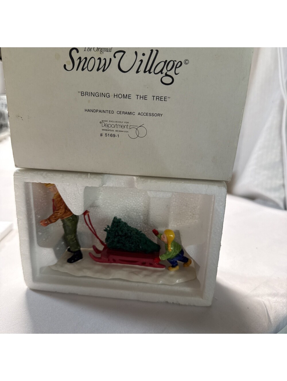 Department 56 Snow Village Bringing Home The Tree 51691